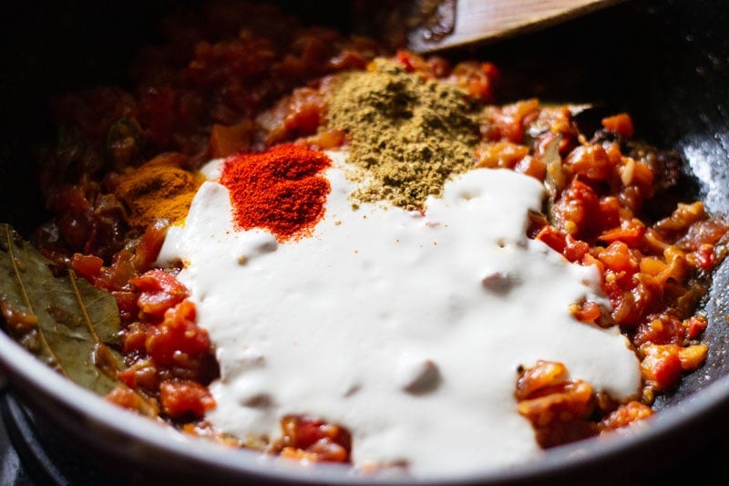 cashew paste, ground spices added to the softened tomatoes