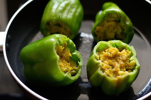 place the stuffed capsicum in the pan