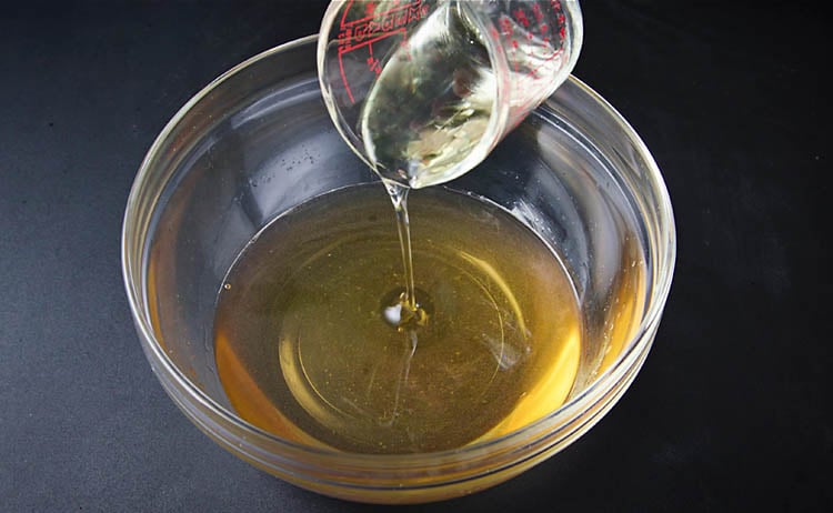 oil being added to the sugar & water solution
