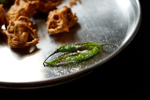 fried chillies on a plate