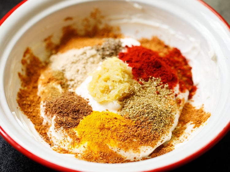 spice powders and salt added to hung curd.