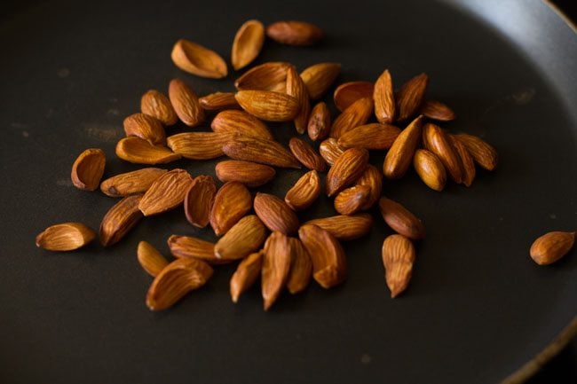 almonds added in a skillet for roasting