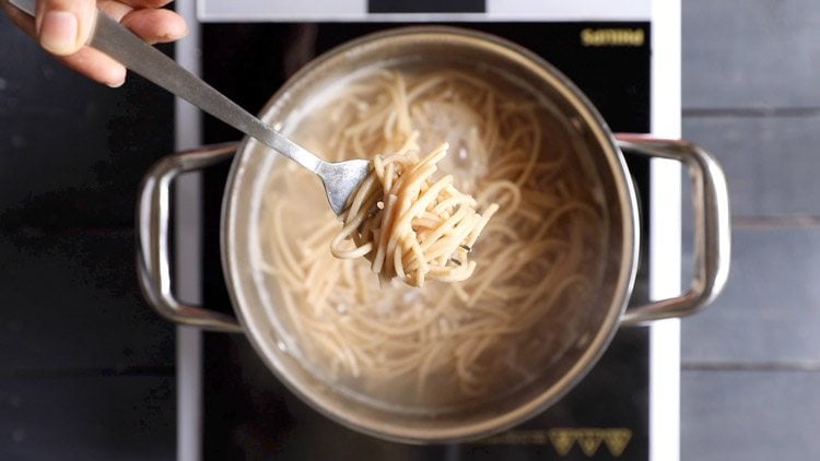 noodles cooked until al dente shown with a fork